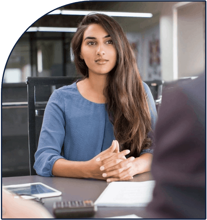 A woman carrying out talent sourcing in an office.